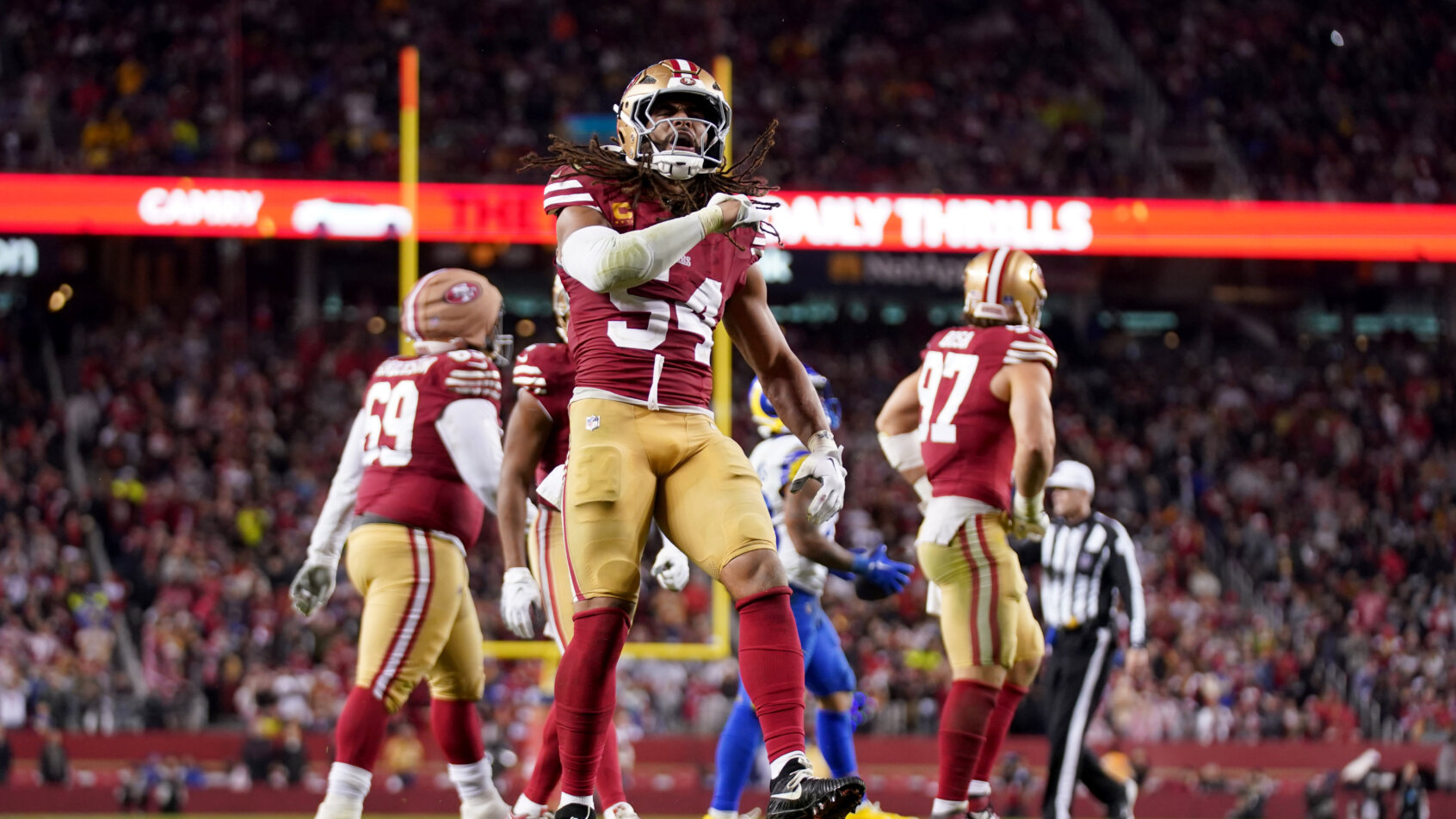 Fred Warner celebrates a tackle for loss