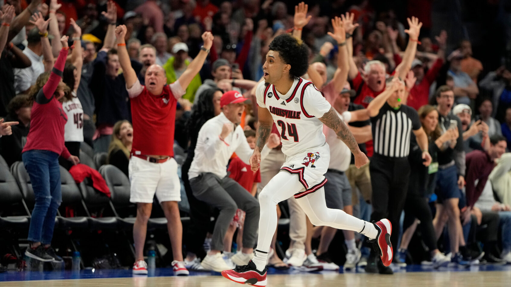 Louisville Cardinals guard Chucky Hepburn reacts