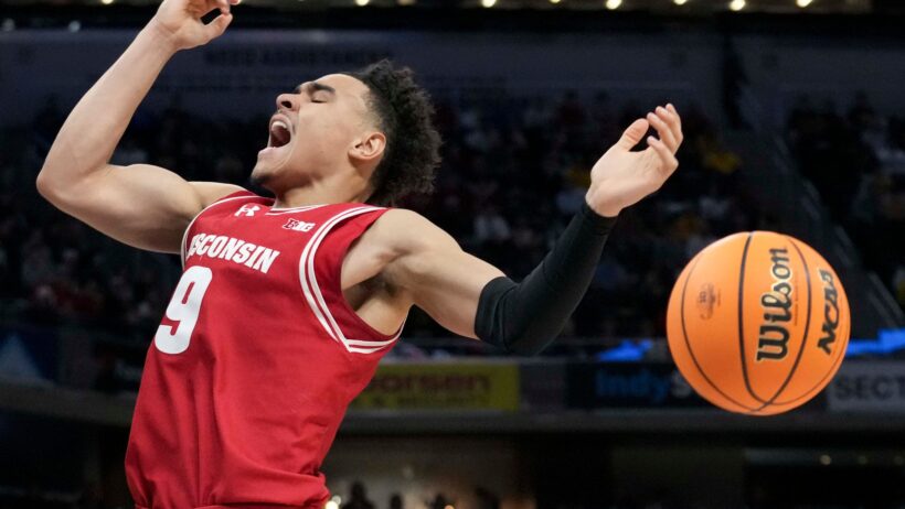 Wisconsin Badgers guard John Tonje reacts after getting fouled