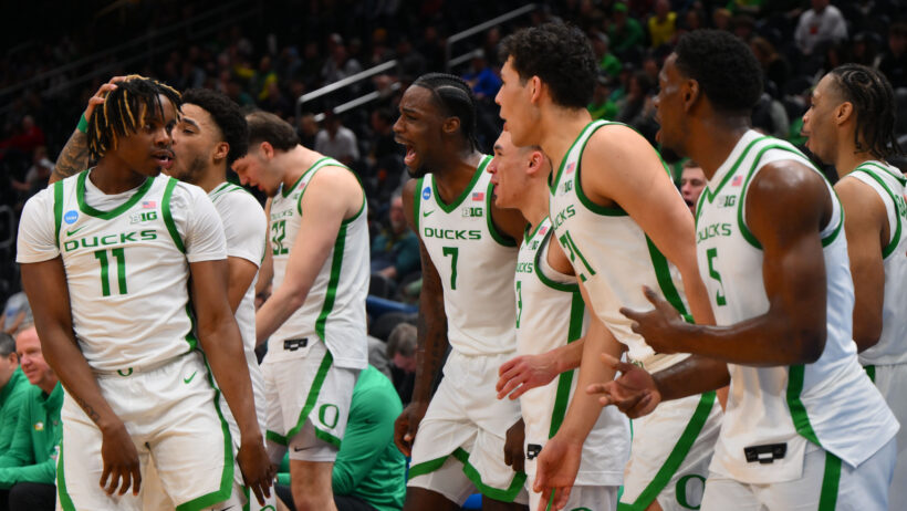 The Oregon Ducks bench celebrates a bucket versus Liberty.