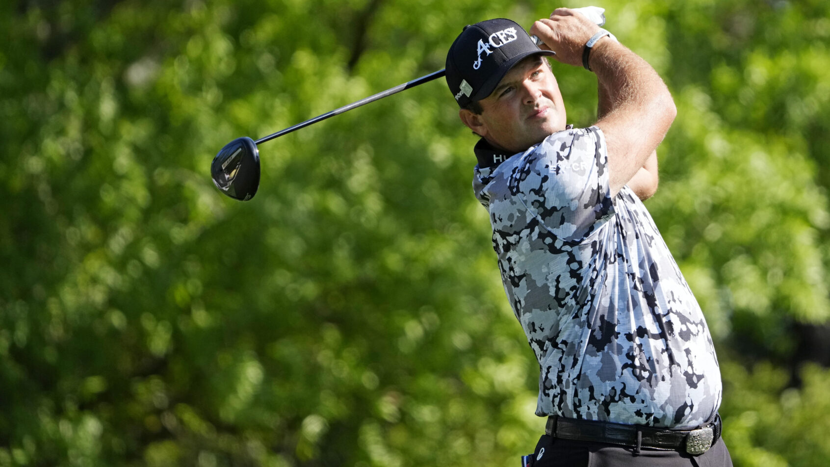 Patrick Reed admires a tee shot at the Masters in Round 1.