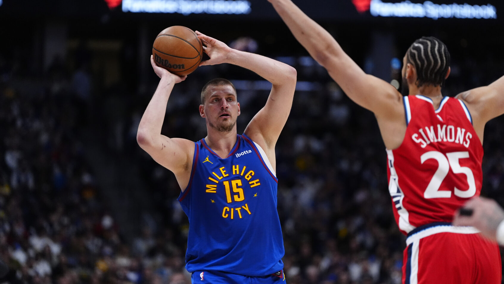 Denver Nuggets center Nikola Jokic looks to make a pass