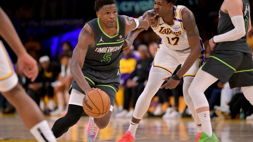 Minnesota Timberwolves guard Anthony Edwards drives to the hoop against Los Angeles Lakers forward Dorian Finney-Smith