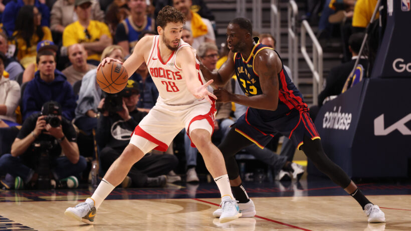 Houston Rockets center Alperen Sengun backs down Golden State Warriors forward Draymond Green
