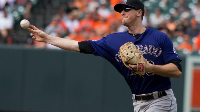DJ LeMahieu making a throw to first-base