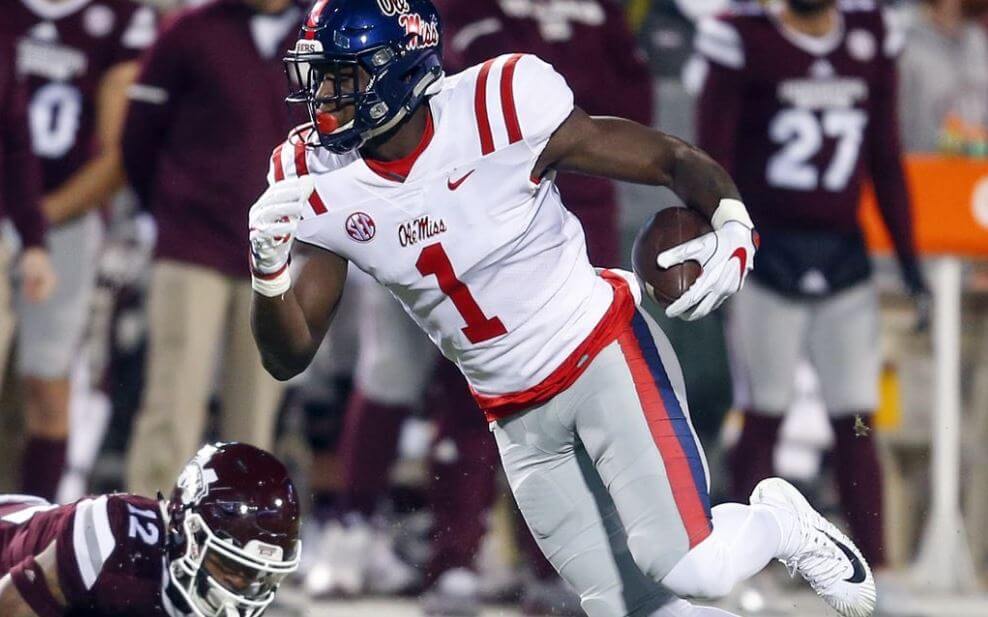 Ole Miss wideout DK Metcalf eludes a Mississippi State defender.