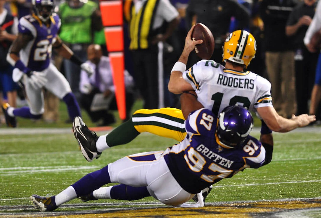 Aaron Rodgers of the Packers being sacked by Everson Griffen of the Vikings