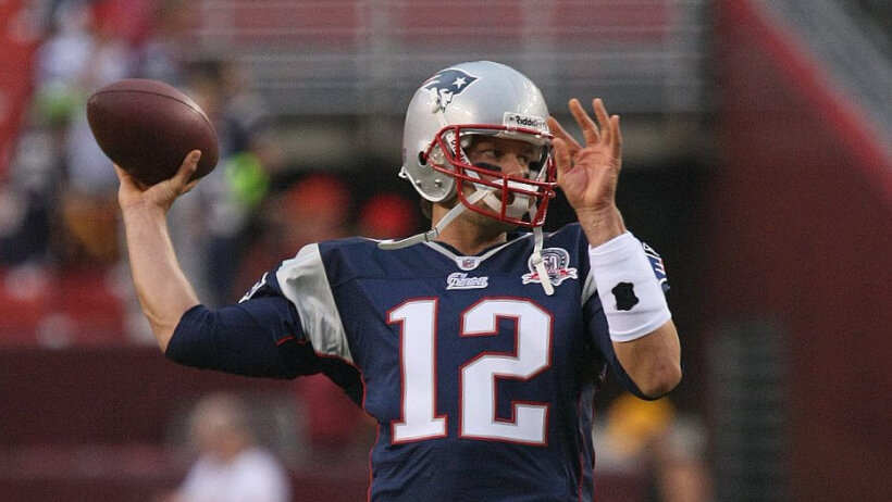Tom Brady of the New England Patriots warming up