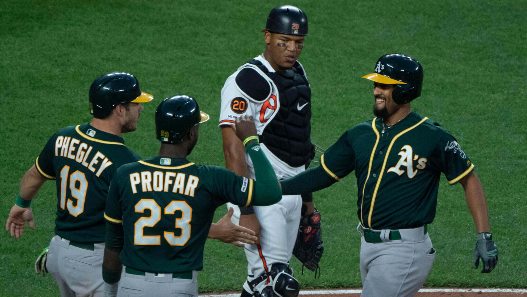 Oakland A's celebrate at home plate