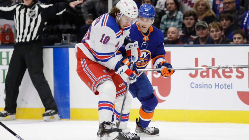 Artemi Panarin fighting off defender