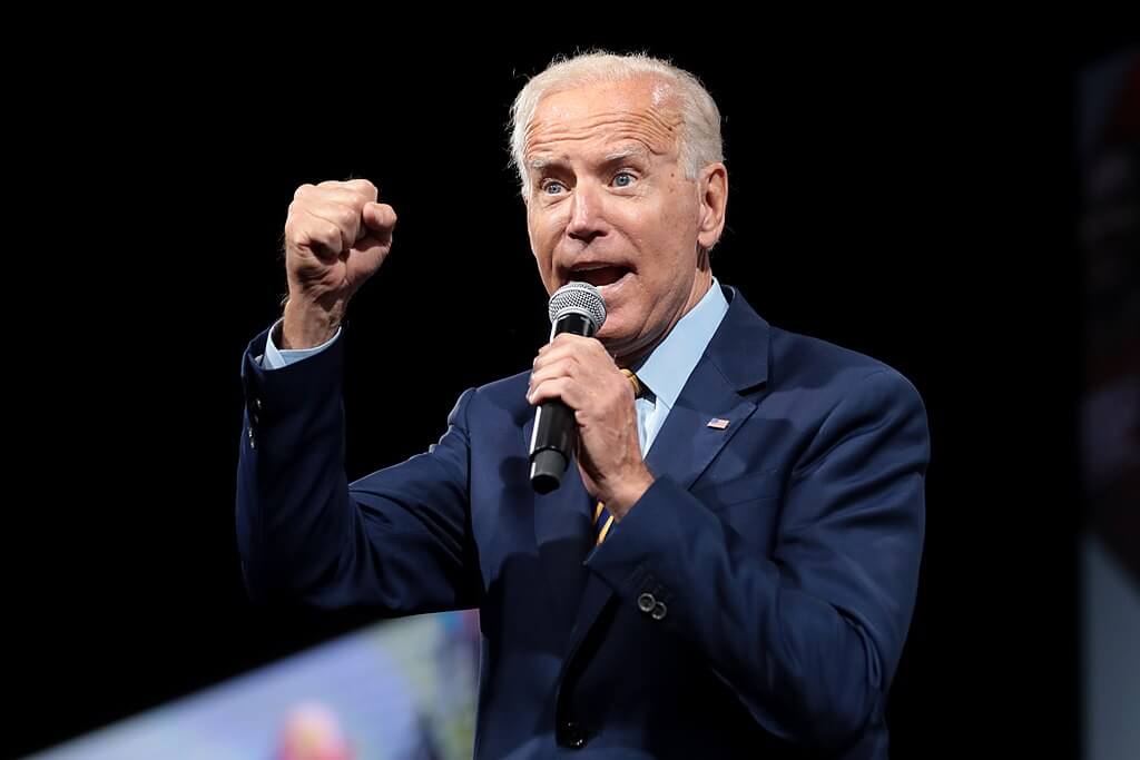 Joe Biden talking into a microphone at a rally