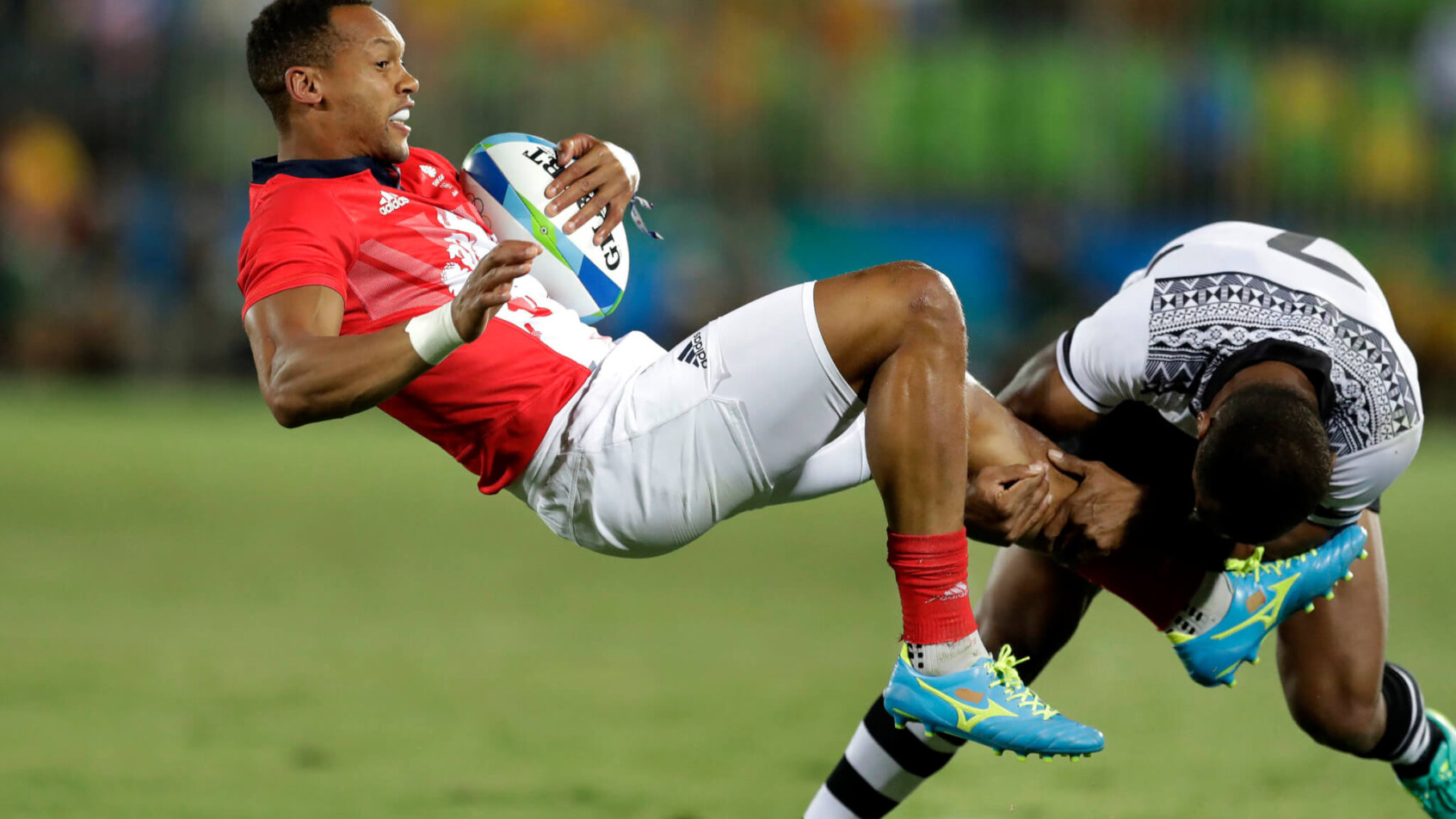 Dan Norton of Great Britain being tackled