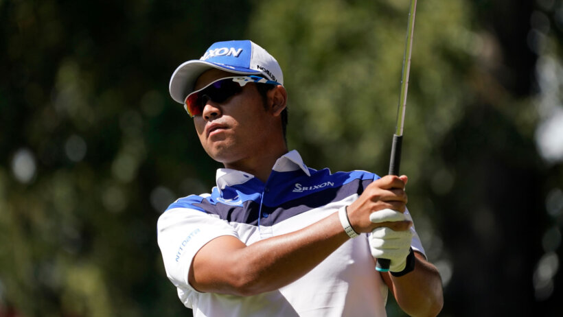 Hideki Matsuyama admires a shot