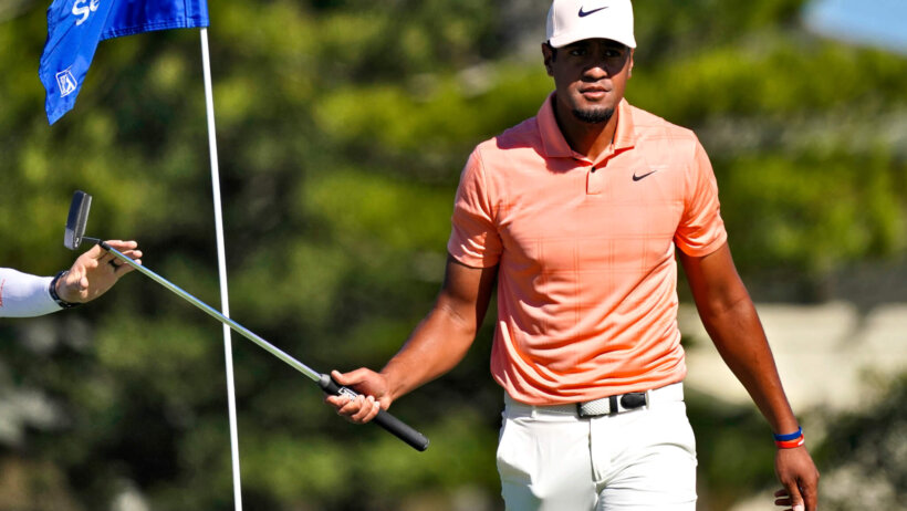 Tony Finau walks off the green