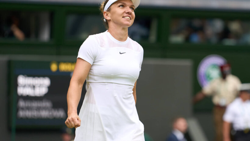 Simona Halep smiling during a match at Wimbledon.