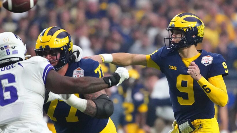 JJ McCarthy throwing the football