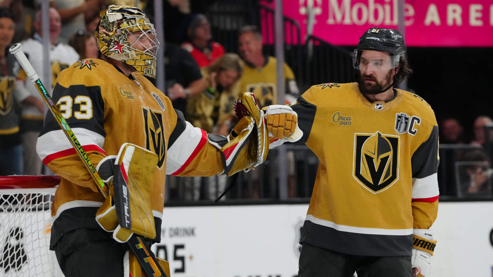 Vegas Golden Knights goaltender Adin Hill celebrates with right winger Mark Stone