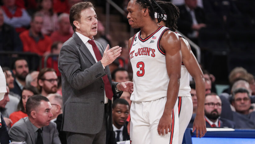 St. John's Red Storm head coach Rick Pitino talks to guard Jordan Dingle