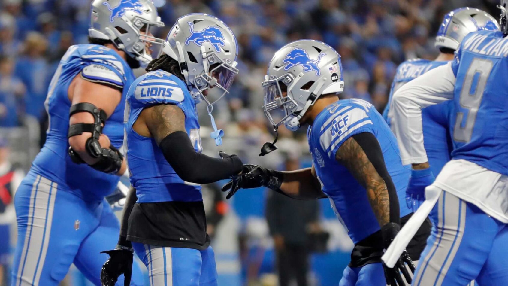 Detroit Lions running backs Jahmyr Gibbs and David Montgomery celebrate