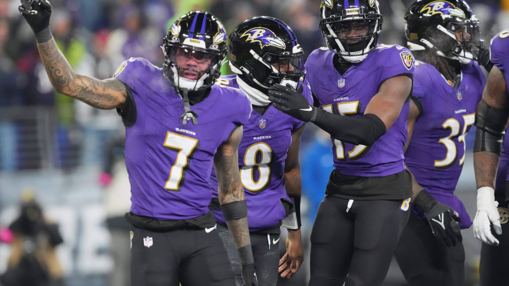 Baltimore Ravens quarterback Lamar Jackson (8) celebrates with wide receiver Rashod Bateman (7) and wide receiver Nelson Agholor (15) after scoring a touchdown