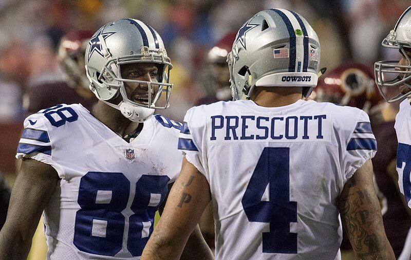 Dak Prescott talking to his receivers.