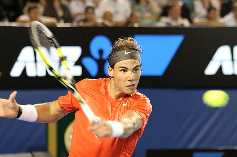 Rafael Nadal returns a ball.